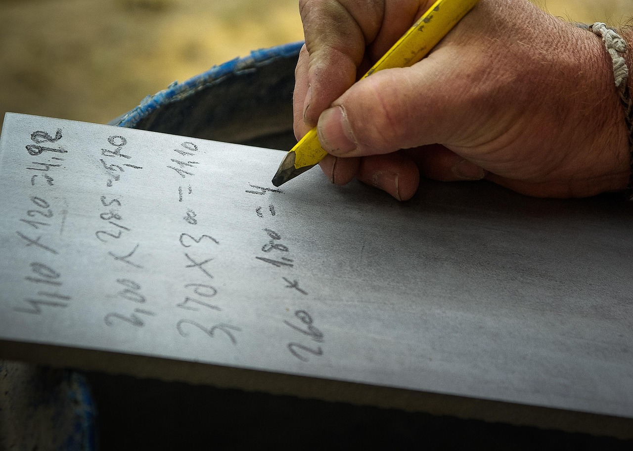 Construction calculation notes with plans and a calculator